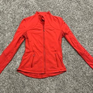 Lululemon define jacket (size 8)- color is between a bright red and an orange.